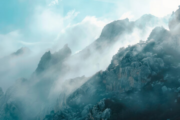 Fototapeta premium Fog veils the mountain peaks, creating an otherworldly and serene ambiance.