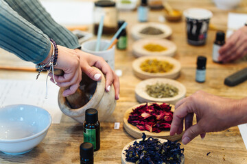 Woman grinding ingredients to create a natural hypoallergenic soap