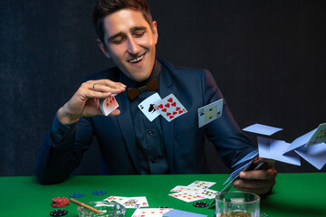 Poker player launches poker cards in a casino.