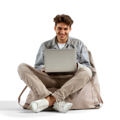 Full length happy young man sit in bag chair unboxing new laptop on transparency background PSD