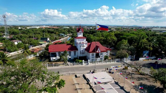 Kawit, Cavite, Philippines - Aerial flyby of Emilio Aguinaldo Shrine and the Philippine Flag.