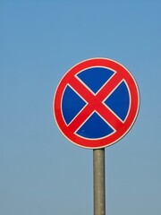 no parking sign on blue sky