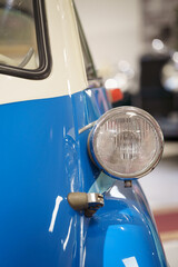 Close up of a vintage blue car headlights 