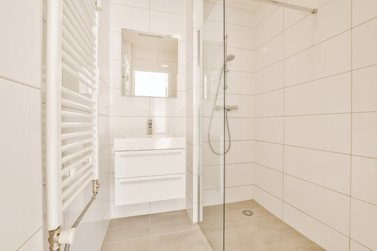 Modern white bathroom interior with shower space