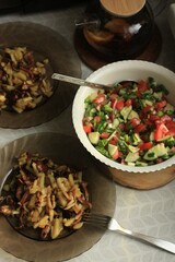 Fried potatoes with chanterelles and salad