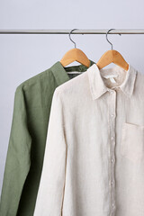 Linen shirts hanging on wooden hangers - 791602965