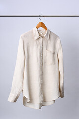 Linen shirt hanging on wooden hanger - 791603318