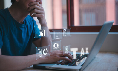 Financial year government taxes and calculation tax return concept. Businessman using the laptop to fill in the income tax online return form for payment