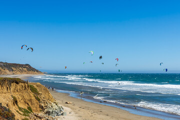Kite surfers in Waddel beach, Santa Cruz, California.