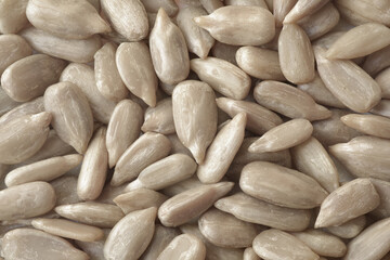 Macro photograph of raw peeled sunflower seeds without shells Top view Background
