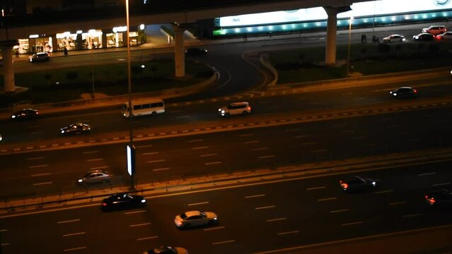  Aerial View of busy Sheikh Zayed Road in Dubai downtown at night time, United Arab Emirates.