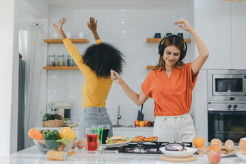 Pride LGBT Family at the kitchen Happy face. Preparing family dinner at home. Happy smiling family having fun cooking at kitchen together. Family lifestyle. Happy together cooking on kitchen.