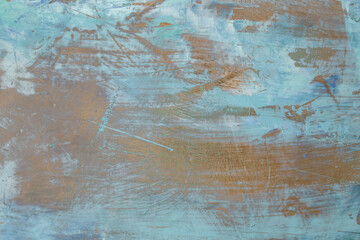 Textured plaster effect on wood grain with gold and blue colors, abstract backdrop