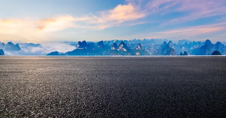 Poster Guilin Asphalt road and karst mountain with sky clouds at sunrise