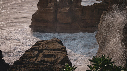 Splash Of Waves Crashing Against The Cliff At Pancake Rocks and Blowholes