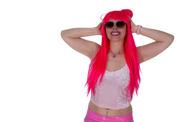 woman in sunglasses, dressed like doll. Beautiful sexy woman, in camisole and pink skirt on white background. Red hair girl wears pink wig with fringe. Posing, modeling, showing emotions, surprise