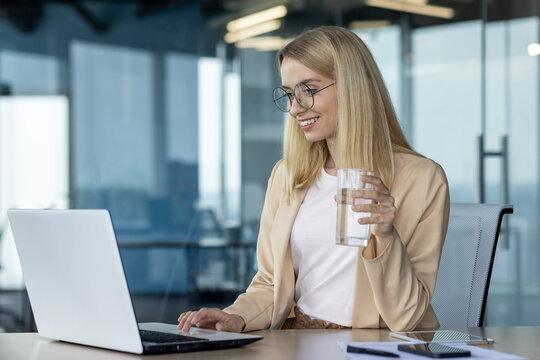 Professional woman enjoying a break at her office desk