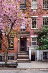 Townhouse in Greenwich Village Historic District with blooming trees in spring. West Village, Manhattan, New York City - 791630338