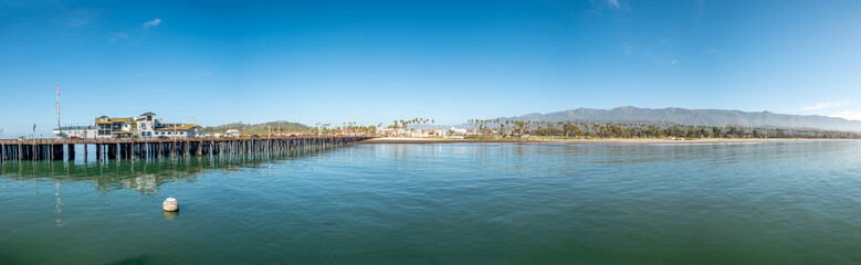 beach promenade with palm trees, pier and sandy beach of Santa Barbara, USA