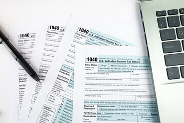 tax form 1040 with pen and notebook. Financial concept.