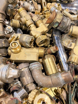 A heap of mixed brass, scrap waste from household plumbing