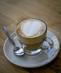 Isolated high resolution large of a single steaming hot coffee cup preparation- cappuccino in a restaurant- Israel
