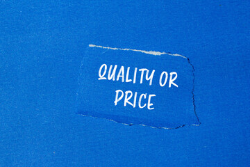 Quality or price words written on ripped blue paper pieces with blue background. Conceptual quality...
