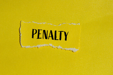 Penalty word written on ripped yellow paper piece with yellow background. Conceptual penalty symbol. Copy space. - obrazy, fototapety, plakaty