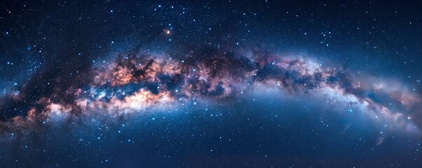 A panoramic view of the Milky Way galaxy, with stars twinkling in the dark blue sky. - obrazy, fototapety, plakaty