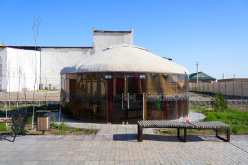 Modern glass transparent yurt outside the Regional History and Aral Sea Museum of Moynaq (Muynak)...