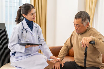 Portrait of smiling caring asian doctor service help support discussing and consulting taking care, caring, caregiver with senior elderly asian man at home visit.senior retirement home care