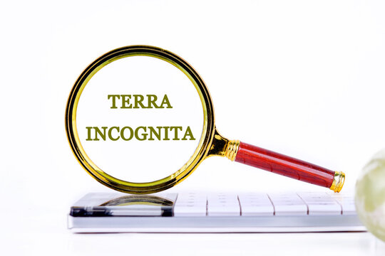 Terra incognita the phrase means unknown land inscription was found using a magnifying glass on the calculator. Concept photo