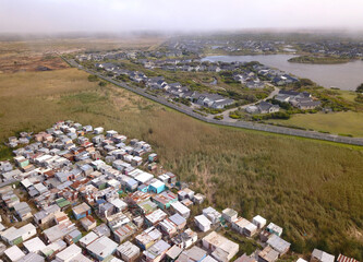 Aerial poor township and rich suburb in South Africa