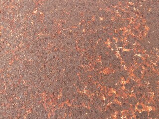 Rust stains mar the car hood, their reddish-brown hues telling tales of neglect and weathering over...