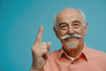 Elderly man with facial hair making peace gesture, suitable for social media or retirement concept - obrazy, fototapety, plakaty