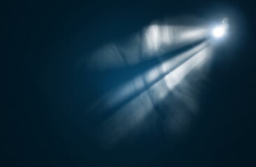 Blue spotlight bright light beam on dark background - obrazy, fototapety, plakaty