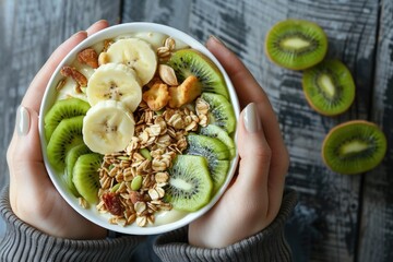 A person holding a bowl of fresh fruits and nuts. Perfect for healthy eating concepts