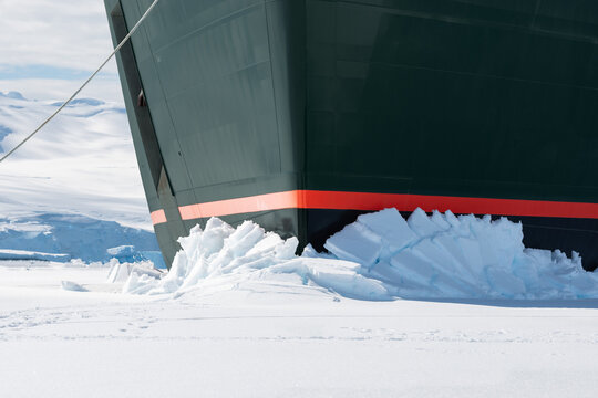 Winter cruise vacation concept. Cruise ship breaking through the ice.