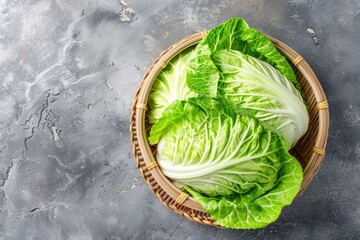 A basket filled with lettuce on a table. Suitable for food and healthy eating concepts