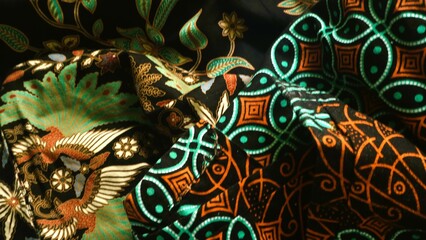 Batik textile with unique pattern from Indonesia,  textured multicolor fabric background