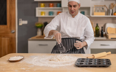 Professional chef kneads dough with expertise. Art of bread-making in a bustling commercial kitchen