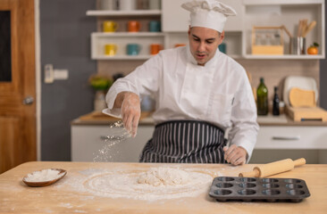 Professional chef kneads dough with expertise. Art of bread-making in a bustling commercial kitchen
