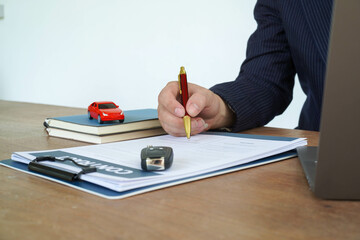 People signing car documents or rental papers Writing your signature on a contract or agreement...