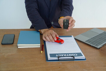 People signing car documents or rental papers Writing your signature on a contract or agreement...