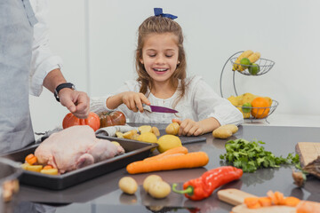 Family sharing a moment cooking together in the kitchen