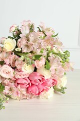 Beautiful bouquet of fresh flowers on table, closeup