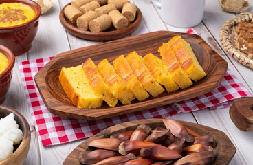 Typical brazilian june festival food over wooden table. Festa junina