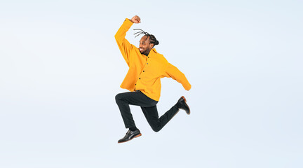 Full body photo of a black man jumping. (We also sell PNGs that are cropped and have transparent...