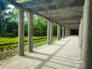 Alley with columns in the summer park of Porto, Portugal