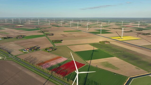 Fields and wind turbines. A wind generator on the  field. View from drone. Green energy production. Landscape from air at the day time. Photo for wallpaper and background. 